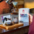 a mobile version of Rio Dulce Colombia coffee beans bag held on a table. next o it a brewed or filtered coffee and its mug next to it